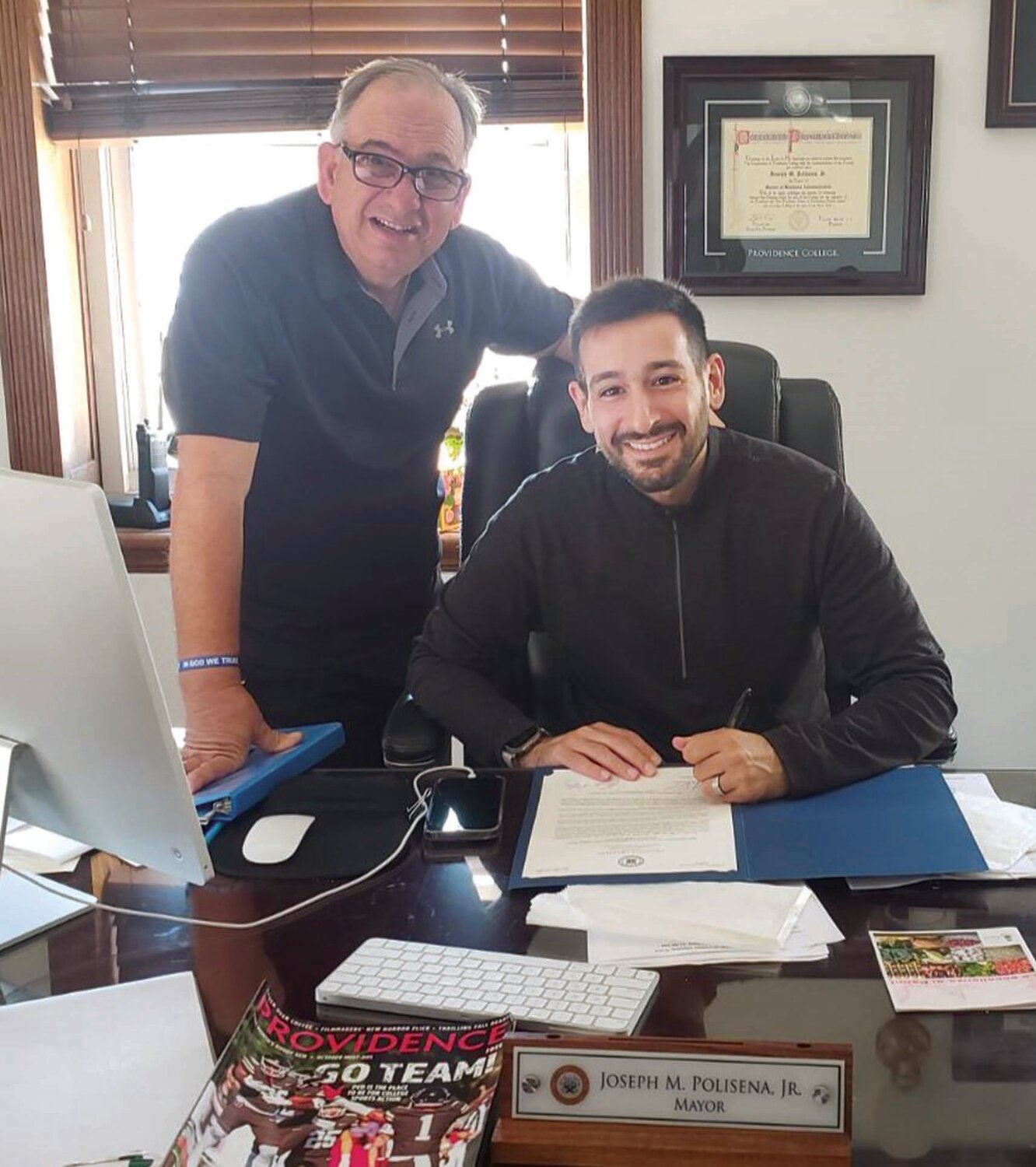 FROM JOHNSTON TO THE BOOT: Spirit of Hope founder Louis J. Spremulli poses with Johnston Mayor Joseph M. Polisena Jr. following their review of the “Sister City” agreement with Panni, Foggia, Italy.
